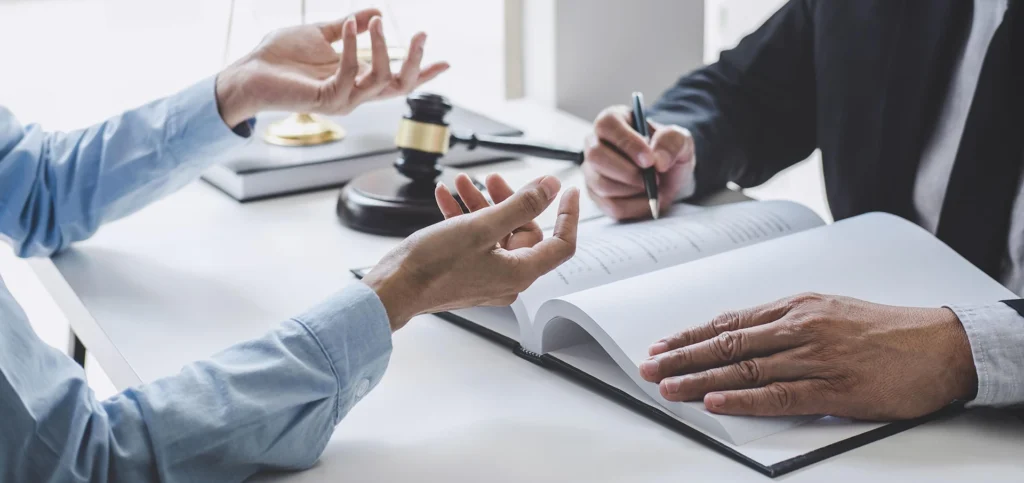 Auctioneer signing an agreement with a buyer